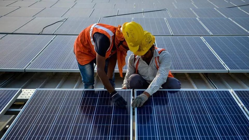 Technicians installing solar modules